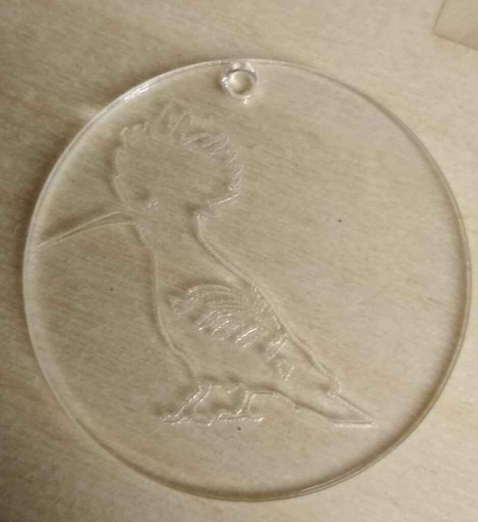 Ziemassvētku rotājums no organiskā stikla